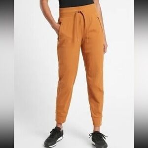 Athleta Plus Size Orange Brown Trekkie North Joggers in Cattail Brown